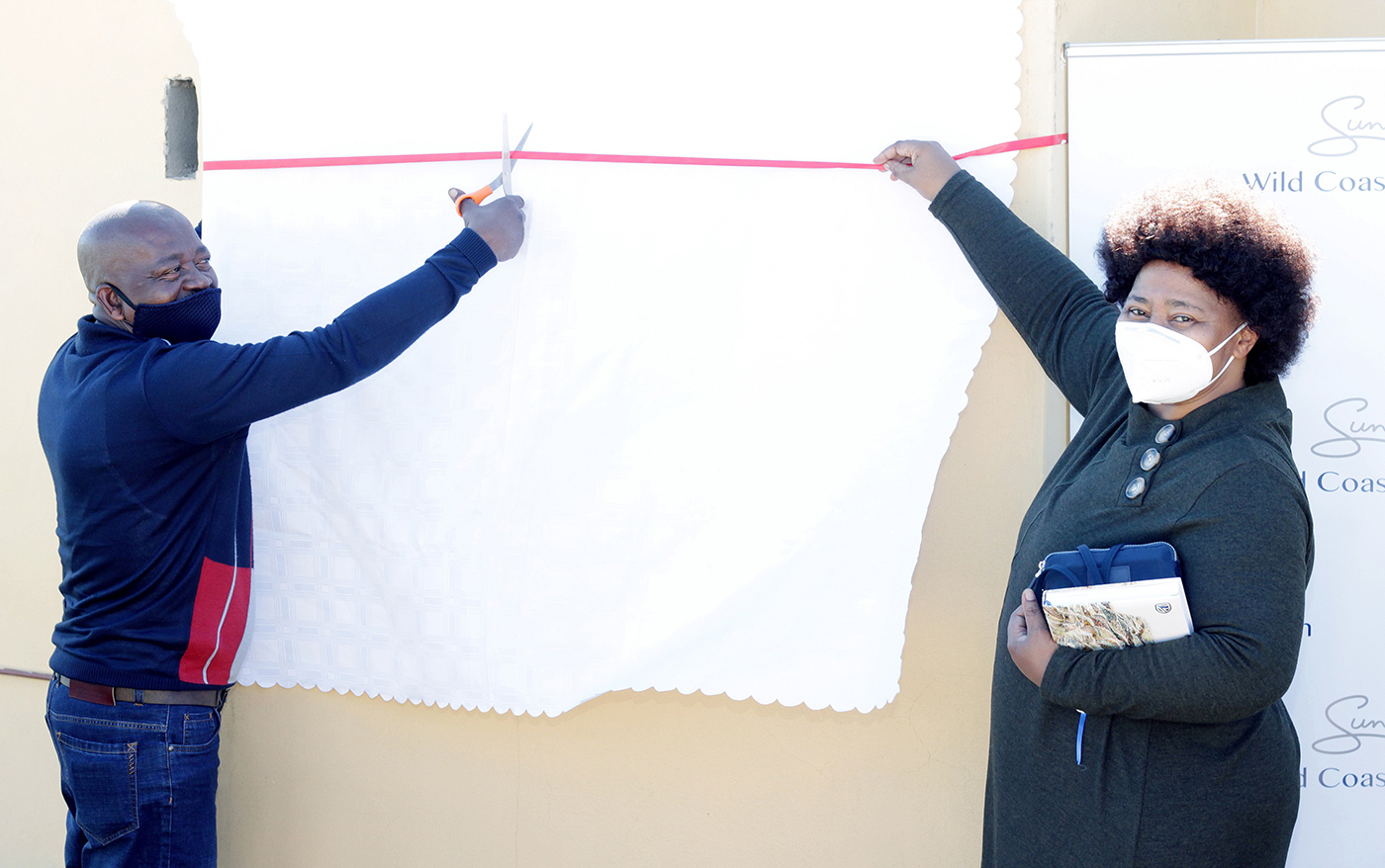 S. Mchunu, chairperson of the Wild Coast Sun CSI Committee, and Z Khuzwayo, district director of Eastern Cape Department of Education, at a ribbon cutting ceremony recently held at the school.