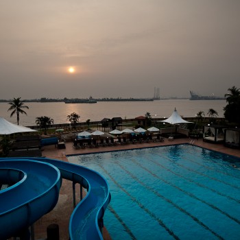 Federal Palace adult pool with slide in view at sunset